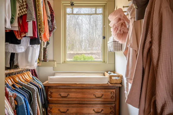 a bathroom with a toilet sink and a mirror