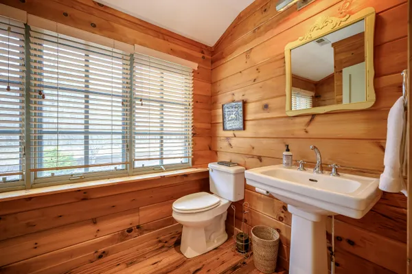 a bathroom with a toilet and a bathtub