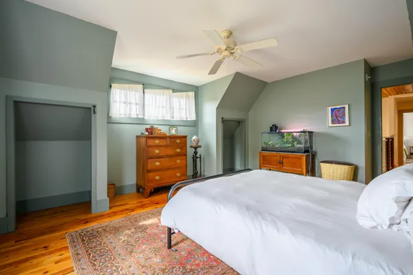 a aerial view of a house with a big yard and potted plants