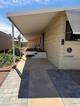 a view of a room with furniture and a window
