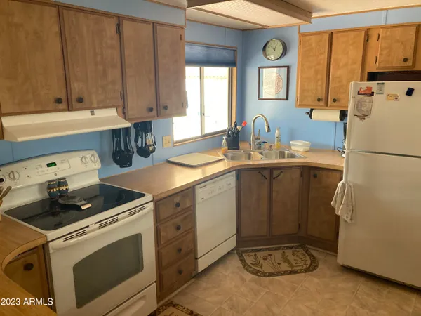 a utility room with sink dryer and washer