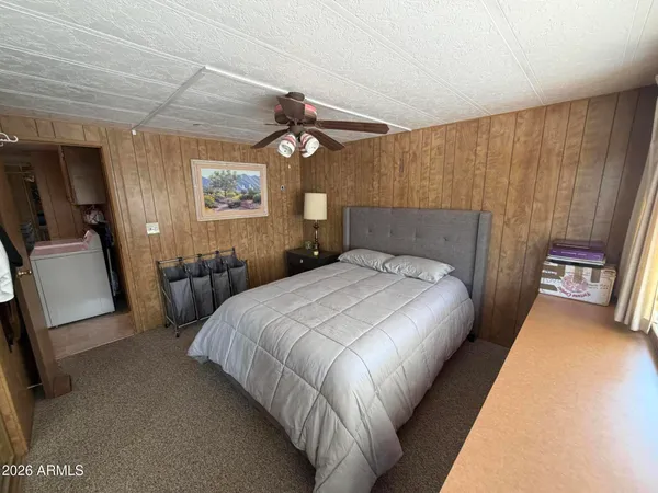 a bedroom with a bed and a walk in closet