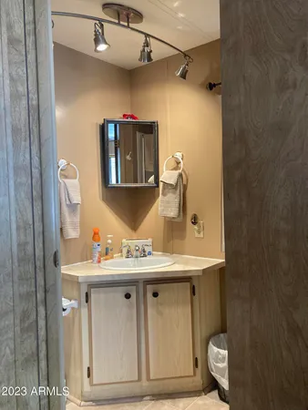 a toilet sitting in a bathroom next to a sink