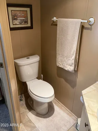 a bathroom with a toilet a sink and a shower