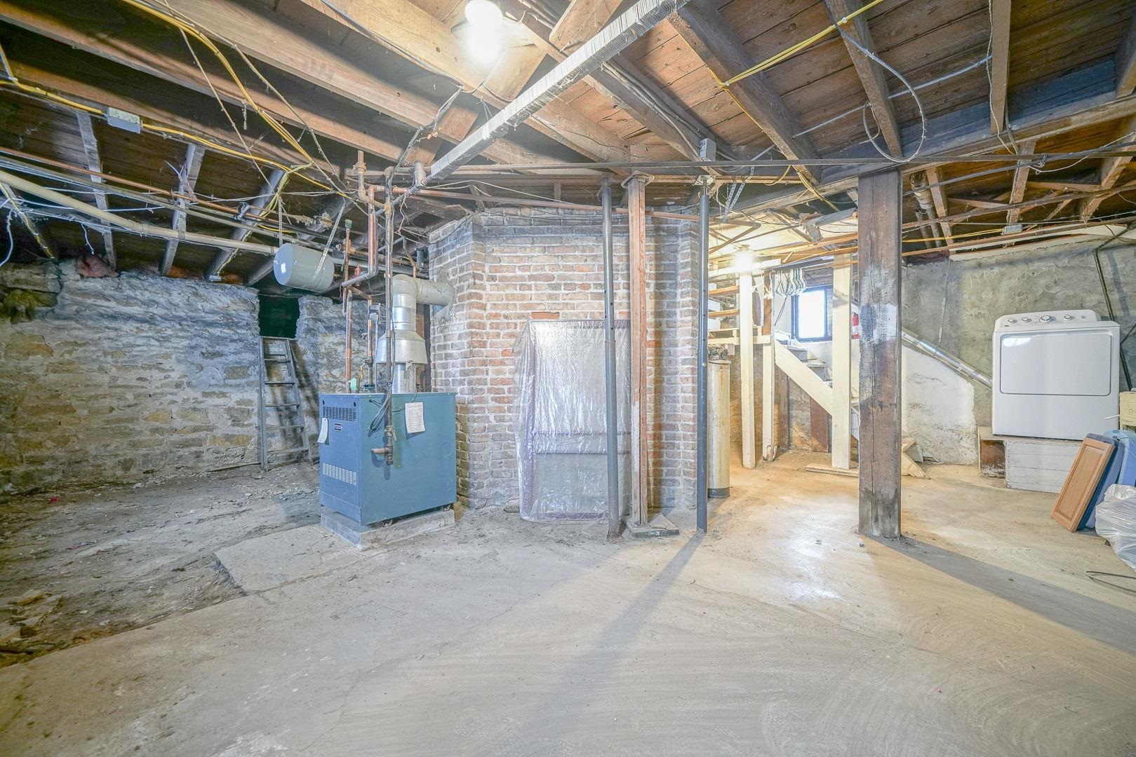 408 South 5th Street Oregon, IL 61061 - Photo 5 of 43 a view of an empty room with wooden walls