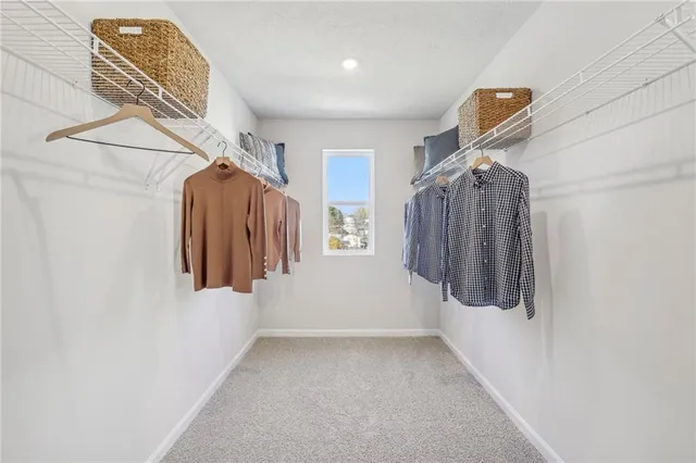 a bathroom with a bathtub shower sink mirror vanity and toilet