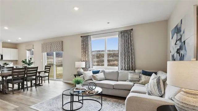 a living room with furniture and windows