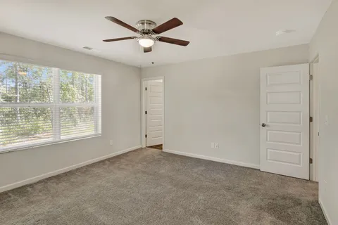 a bathroom with a glass shower door