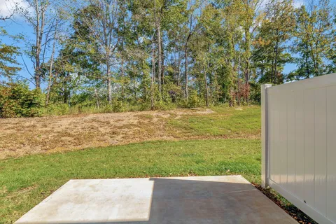 a view of a house with backyard
