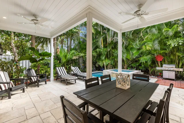 a kitchen with sink and view of living room