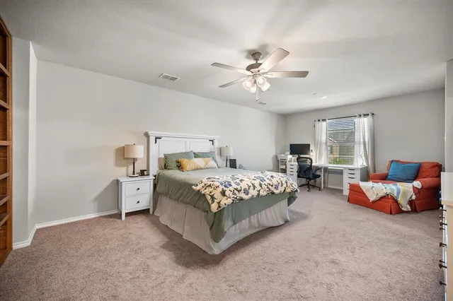 a bedroom with bed and window