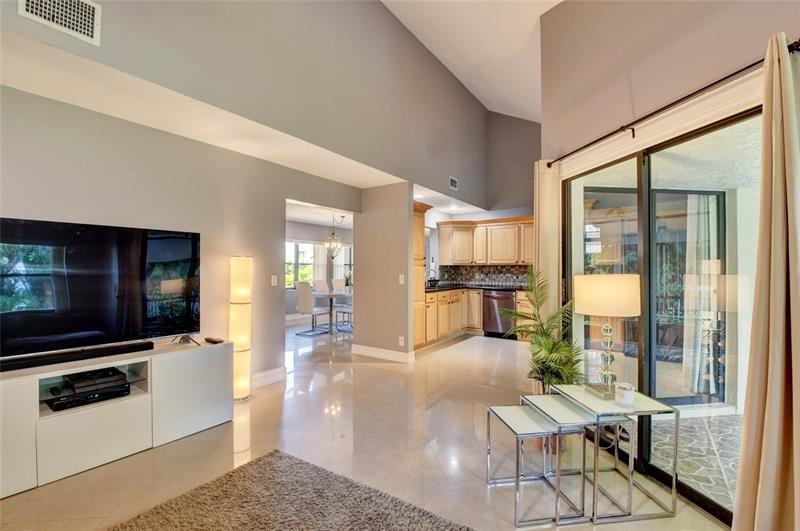 9316 Ketay Circle Boca Raton, FL 33428 - Photo 11 of 30 a living room with patio furniture and a flat screen tv