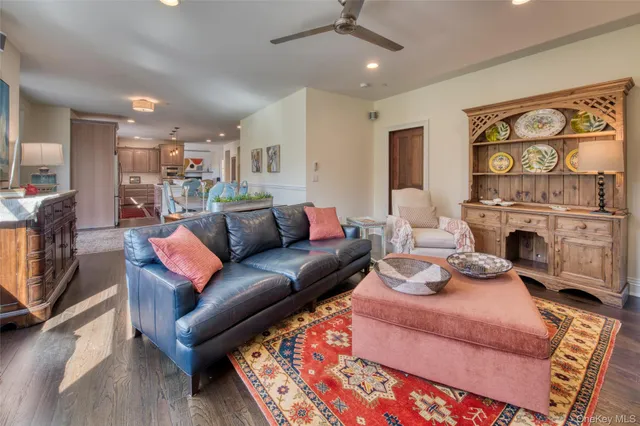 a living room with furniture fireplace and flat screen tv