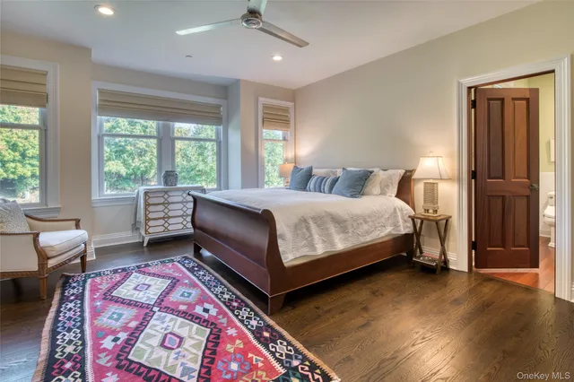 a bedroom with a bed couch and a window
