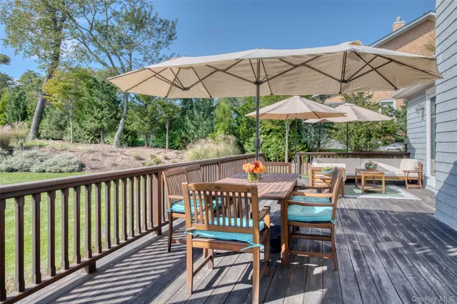 a view of a chair and table on the deck