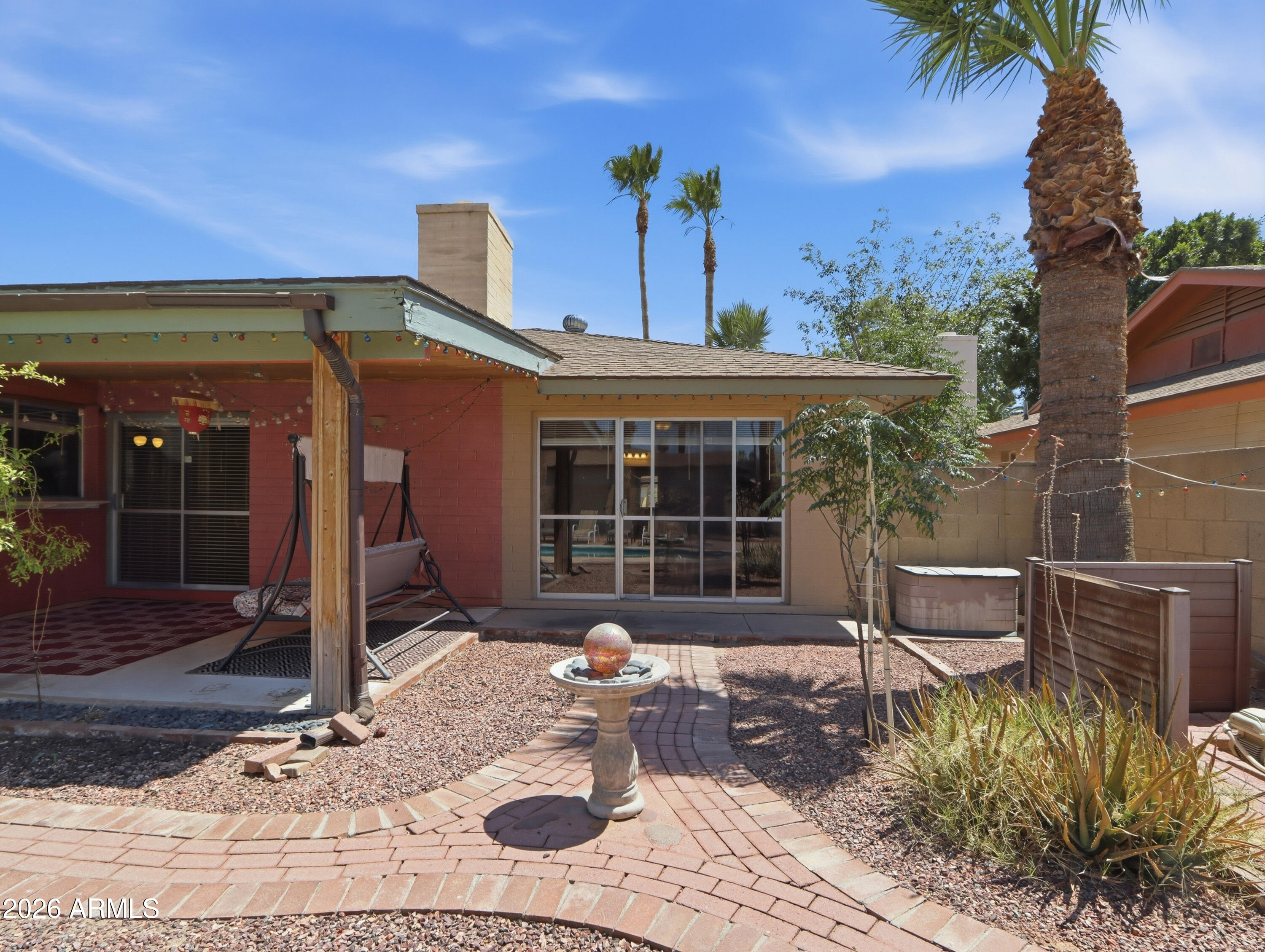 450 Cascada Road Litchfield Park, AZ 85340 - Photo 29 of 40 a front view of a house with garden