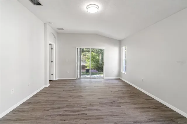 a view of a park with large trees