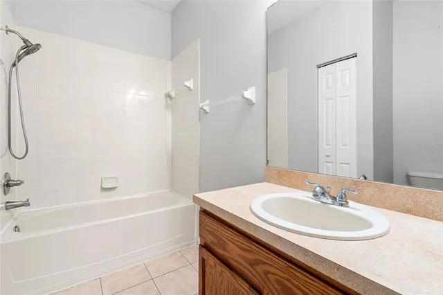 a view of a house with backyard and garden