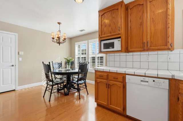 a view of an house with backyard porch and furniture