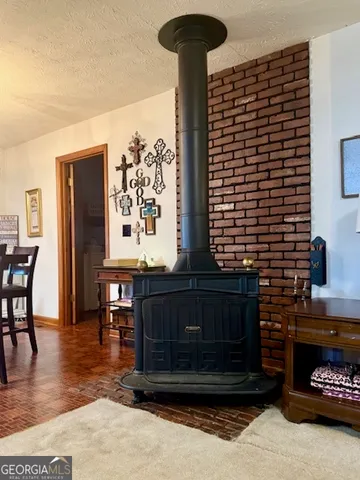 a kitchen with a table and a chair
