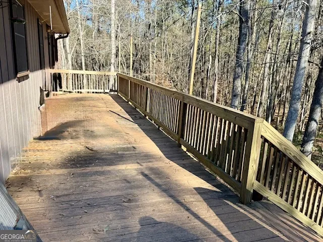 a view of a balcony with wooden floor