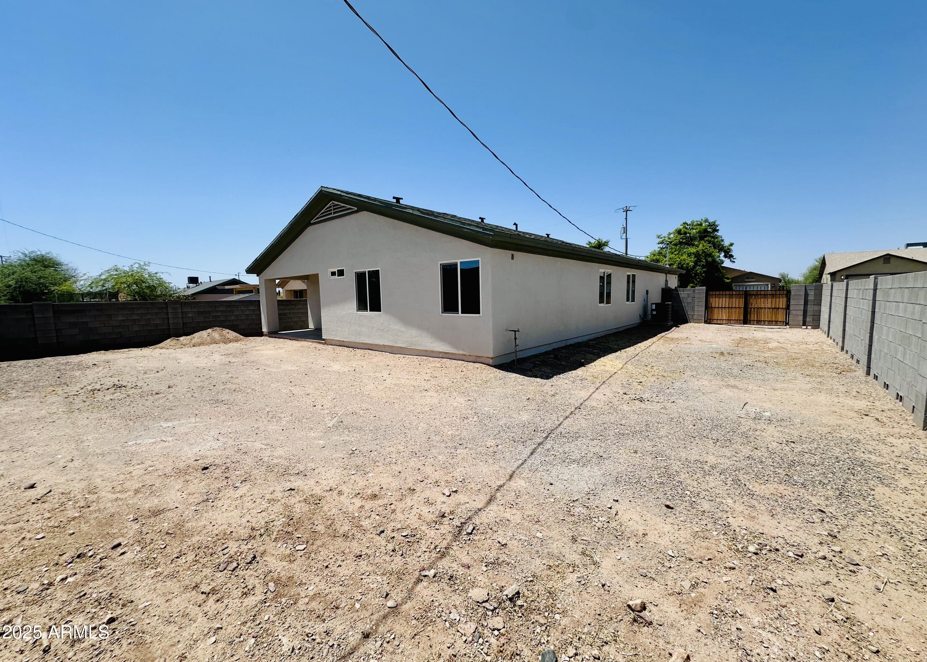 32007 North Bush Street Wittmann, AZ 85361 - Photo 21 of 22 a view of a house with a yard