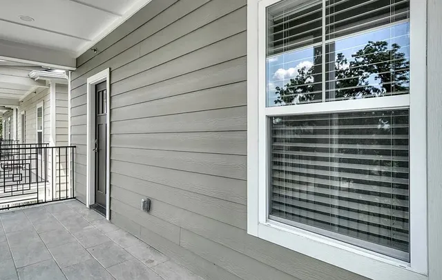 a view of a door and a window