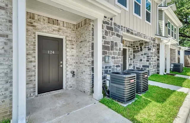 an outdoor view of a house with a yard