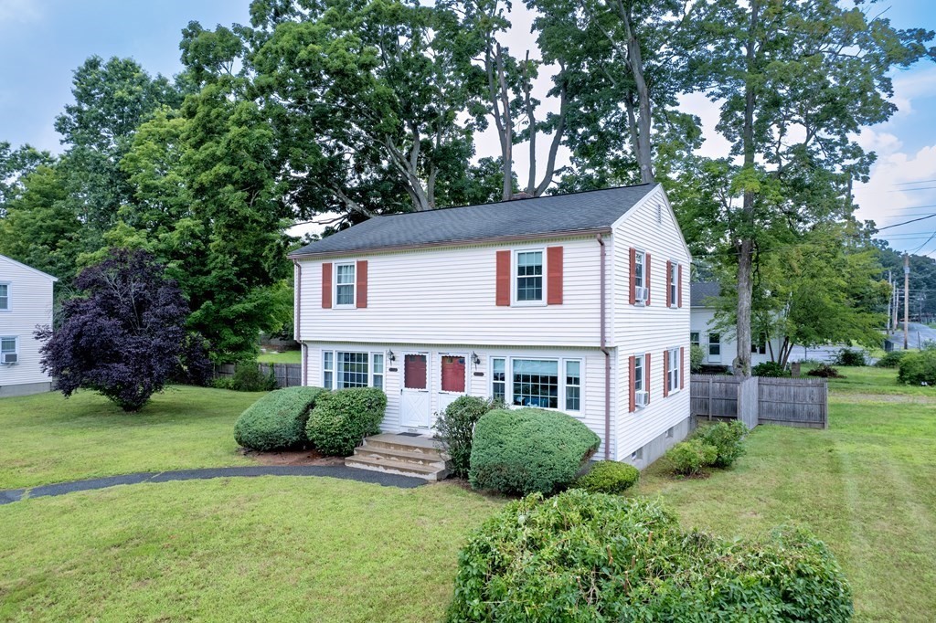 40 Prospect Street, Unit 1B Westfield, MA 01085 - Photo 1 of 24 a view of a house with a yard and potted plants