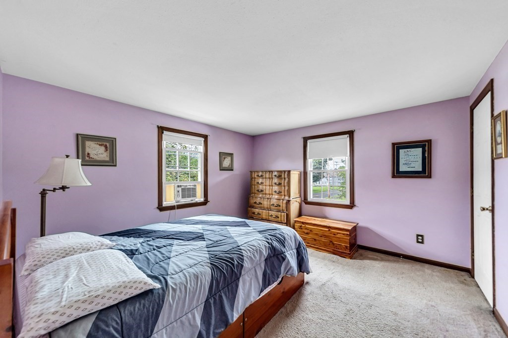 40 Prospect Street, Unit 1B Westfield, MA 01085 - Photo 11 of 24 a spacious bedroom with a bed and a window