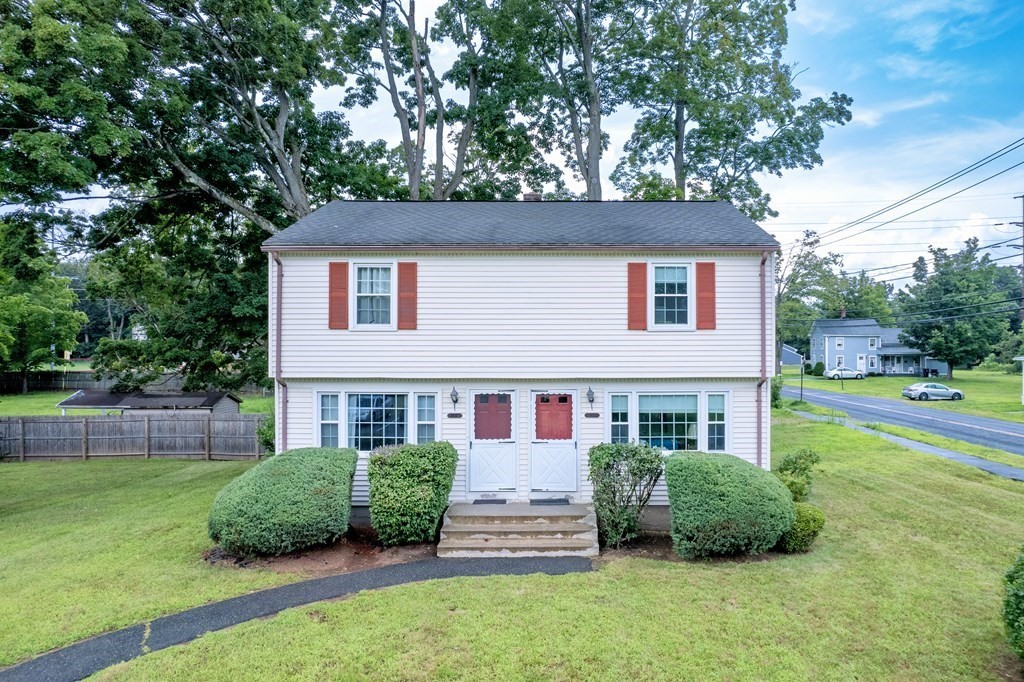 40 Prospect Street, Unit 1B Westfield, MA 01085 - Photo 2 of 24 a front view of a house with a yard