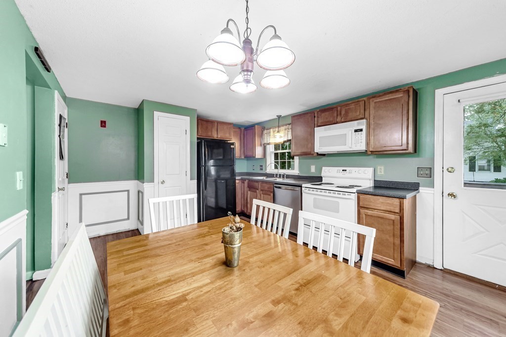 40 Prospect Street, Unit 1B Westfield, MA 01085 - Photo 4 of 24 a large kitchen with kitchen island a large counter space a sink stainless steel appliances and cabinets