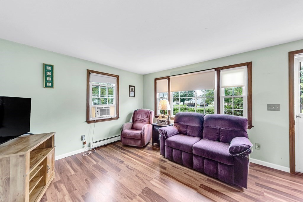 40 Prospect Street, Unit 1B Westfield, MA 01085 - Photo 7 of 24 a living room with furniture and a flat screen tv