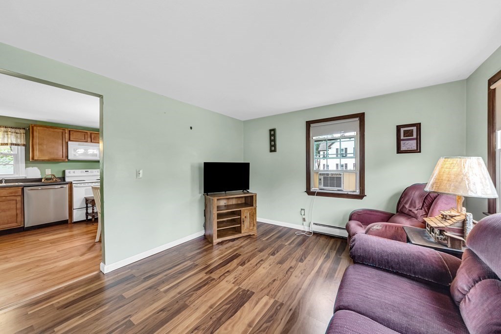 40 Prospect Street, Unit 1B Westfield, MA 01085 - Photo 9 of 24 a living room with furniture and a flat screen tv