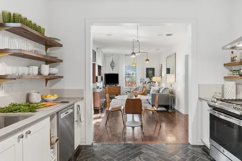 a view of a living room and dining room