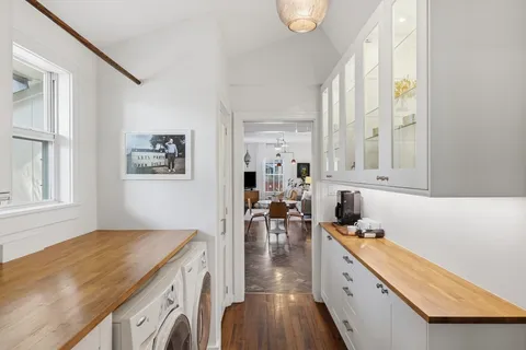 a kitchen with a stove a sink and a refrigerator