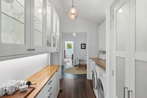 a very nice looking room with wooden floor and furniture