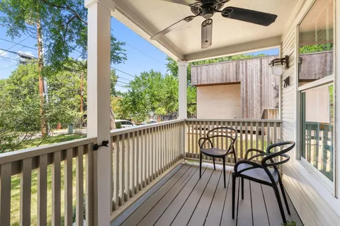 a view of a balcony with furniture