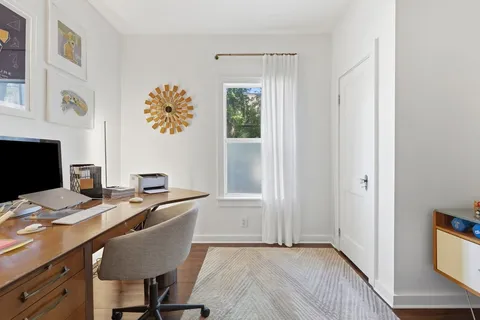 a workspace with furniture and window