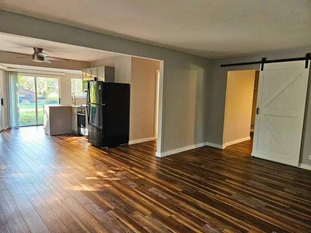 a view of a livingroom with wooden floor