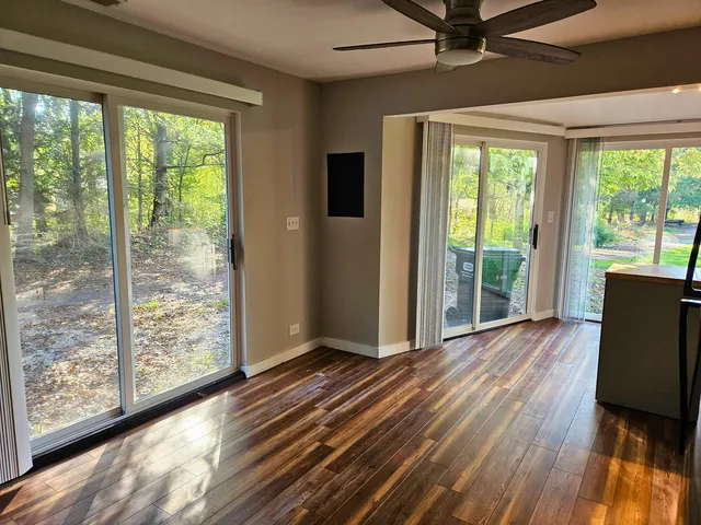 a view of a room with wooden floor and walls