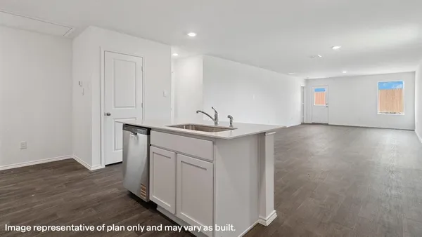 a view of a sink storage and utility room with wooden floor