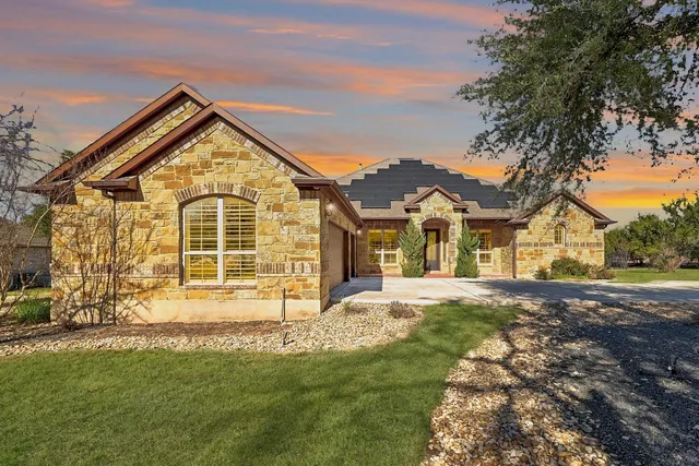 a view of a yard in front of a house