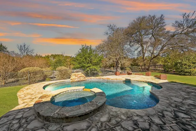a view of a swimming pool with an outdoor space and seating area