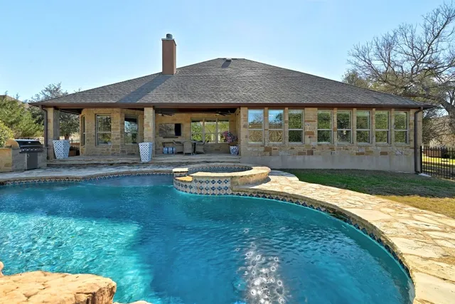 a view of a house with swimming pool