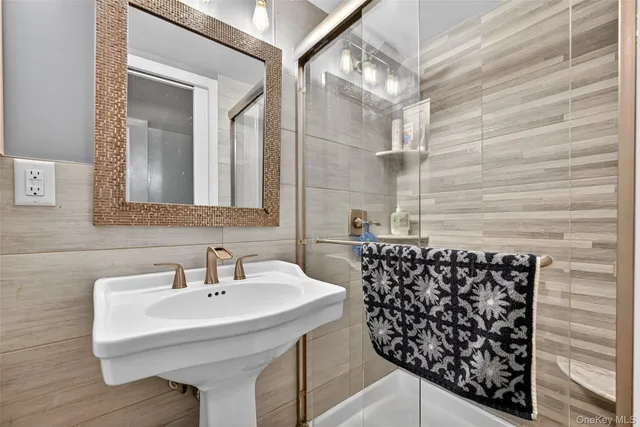 a bathroom with a sink and mirror