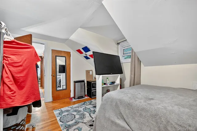 a bathroom with a sink mirror vanity and toilet
