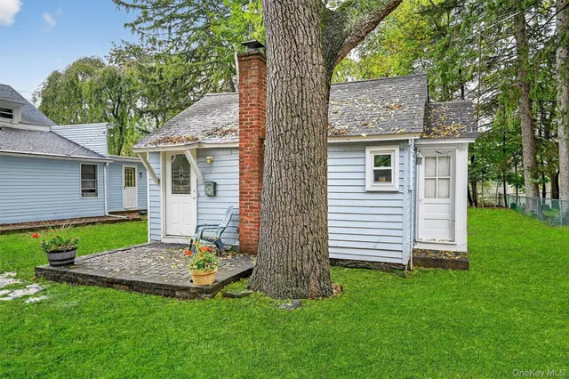 a view of swimming pool with a yard and trees