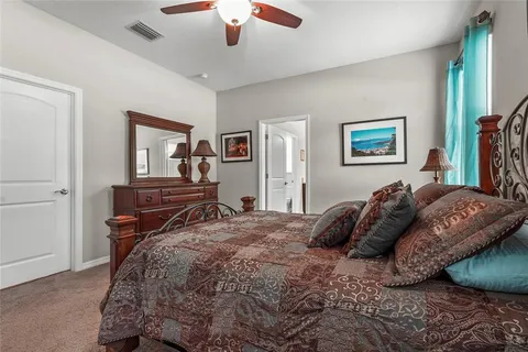a spacious bathroom with a double vanity sink and a mirror