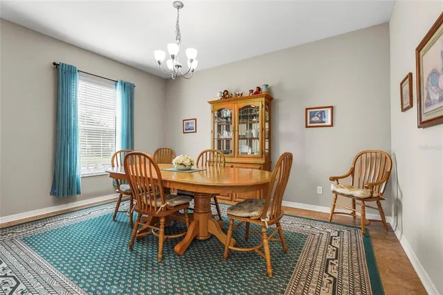 a dining room with furniture and window